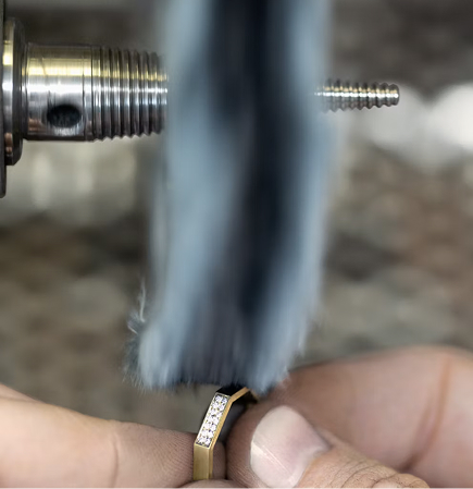 Greek artisan crafting jewelry by hand in Athens workshop